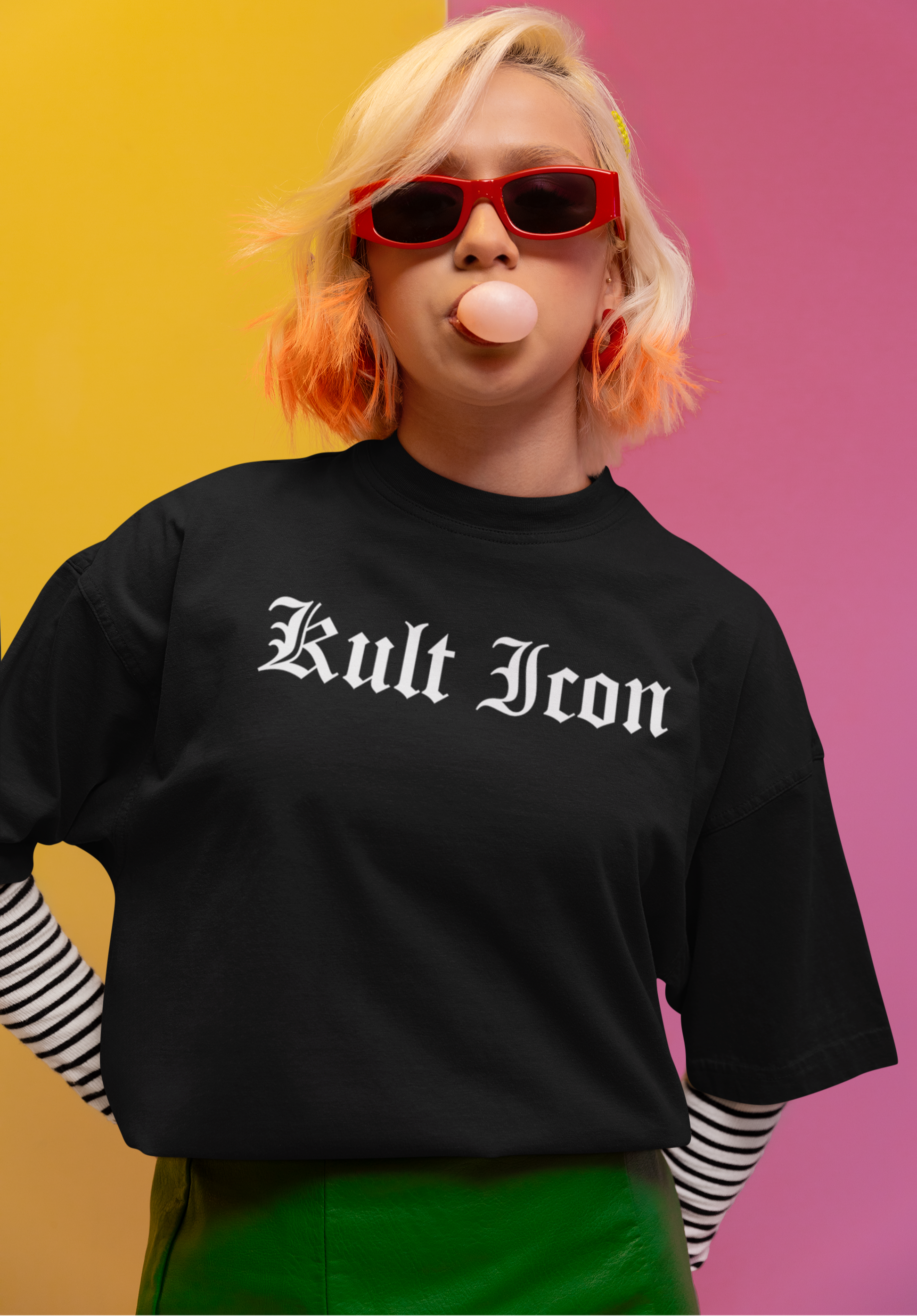 Person wearing a black 'Kult Iron' t-shirt with a colorful background