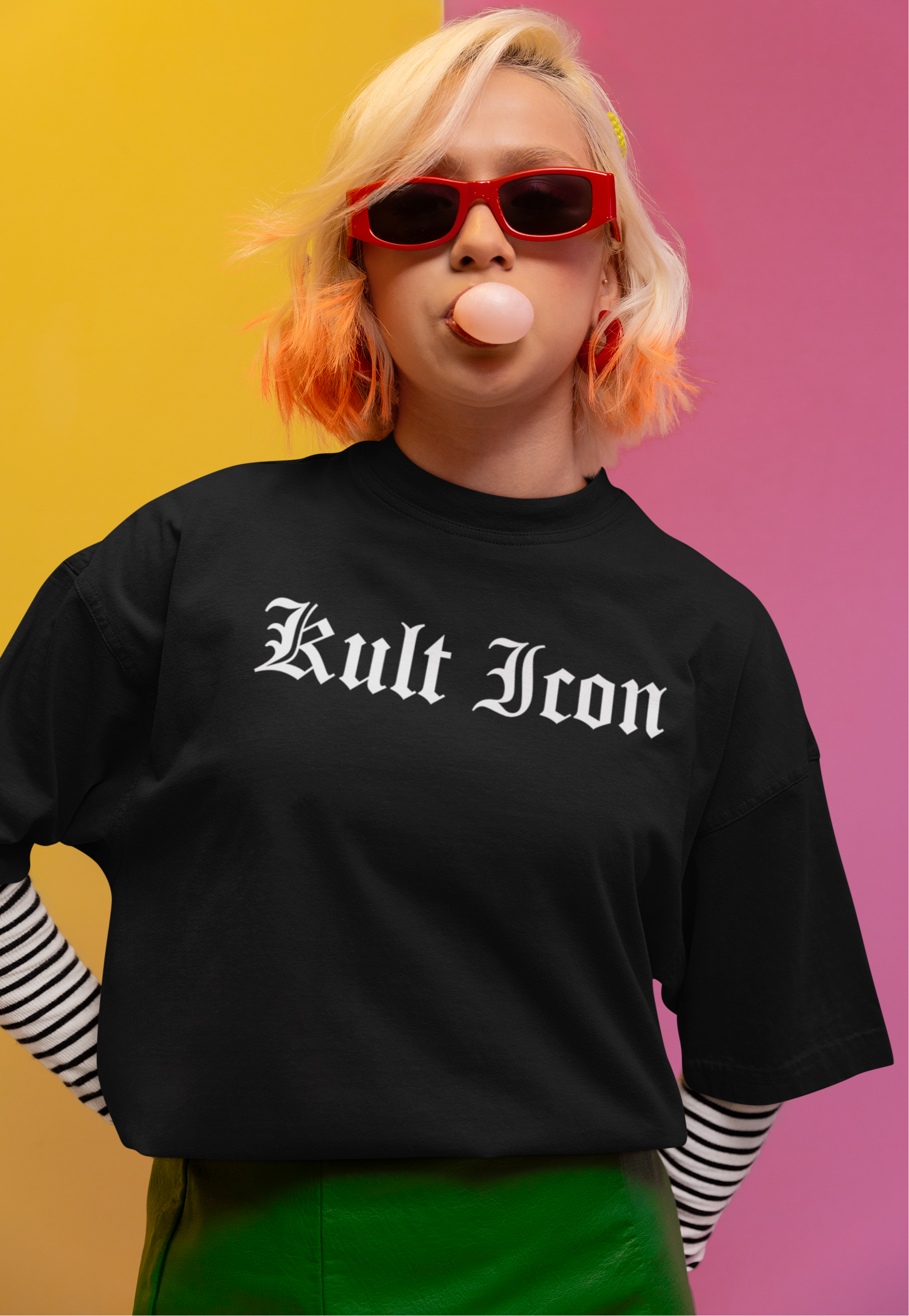 Person wearing a black 'Kult Iron' t-shirt with a colorful background