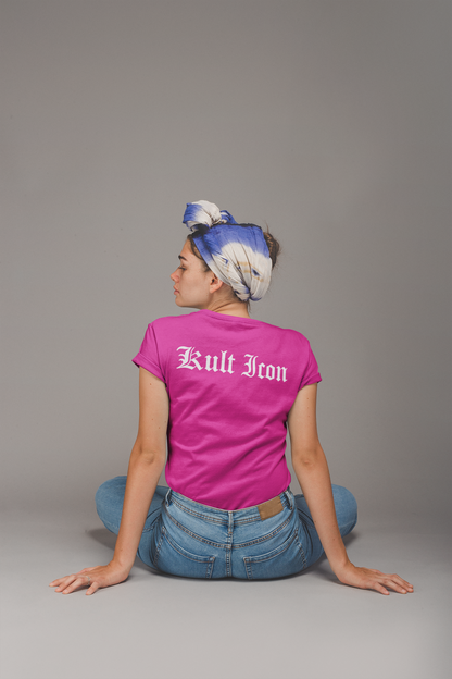 Person wearing a pink 'Kult Iron' t-shirt sitting on the floor with a gray background