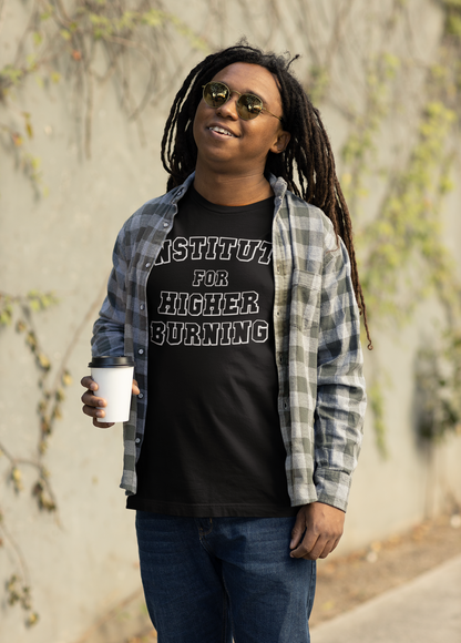 Person wearing a black t-shirt with 'Institute for Higher Burning' text, standing outdoors.