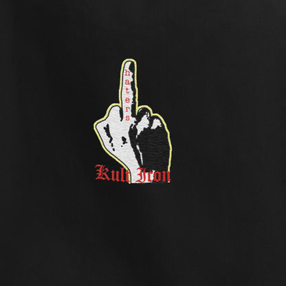 Embroidered design of a hand with a middle finger and 'Kult Iron' text on a black background