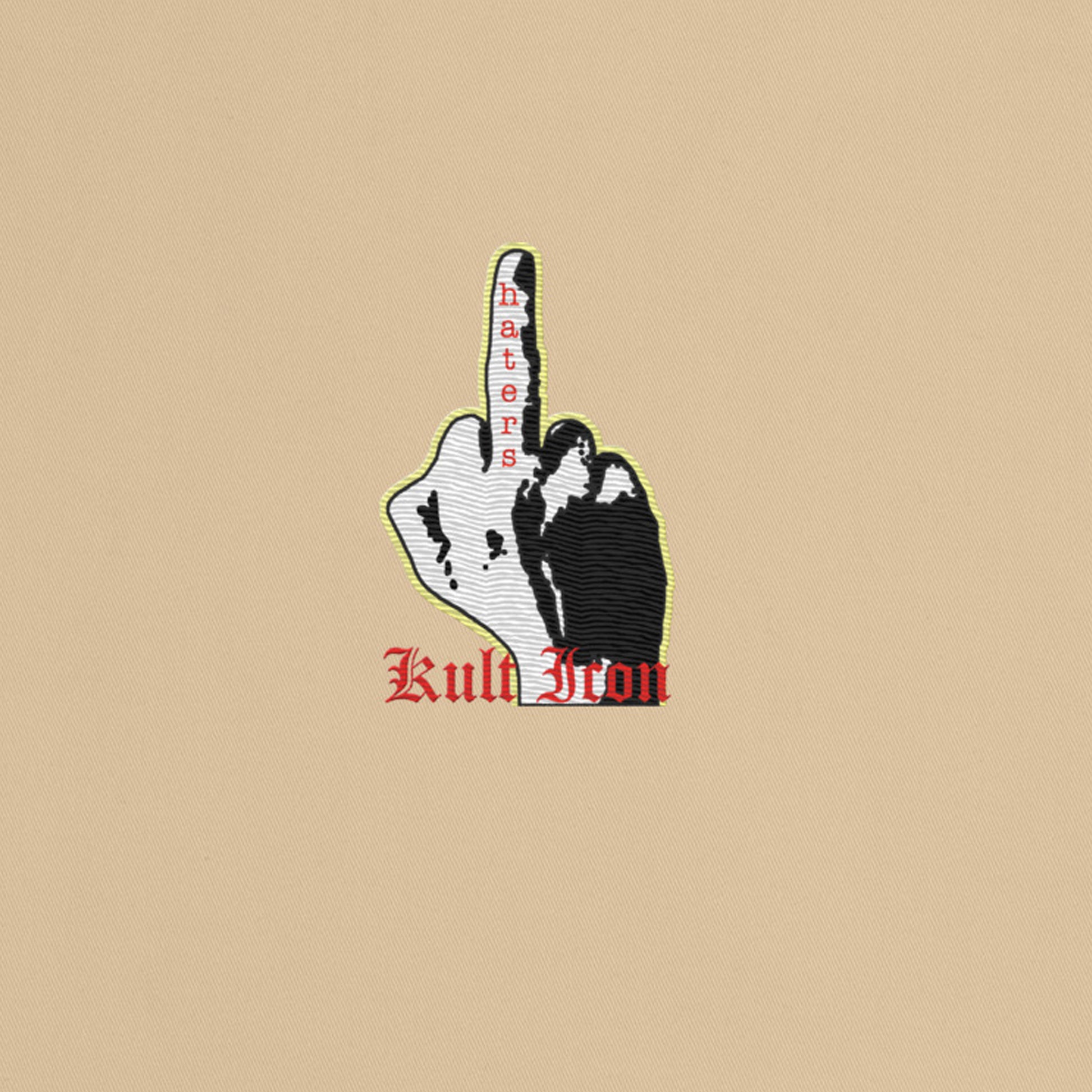 Patch with a hand gesture and text on a beige background