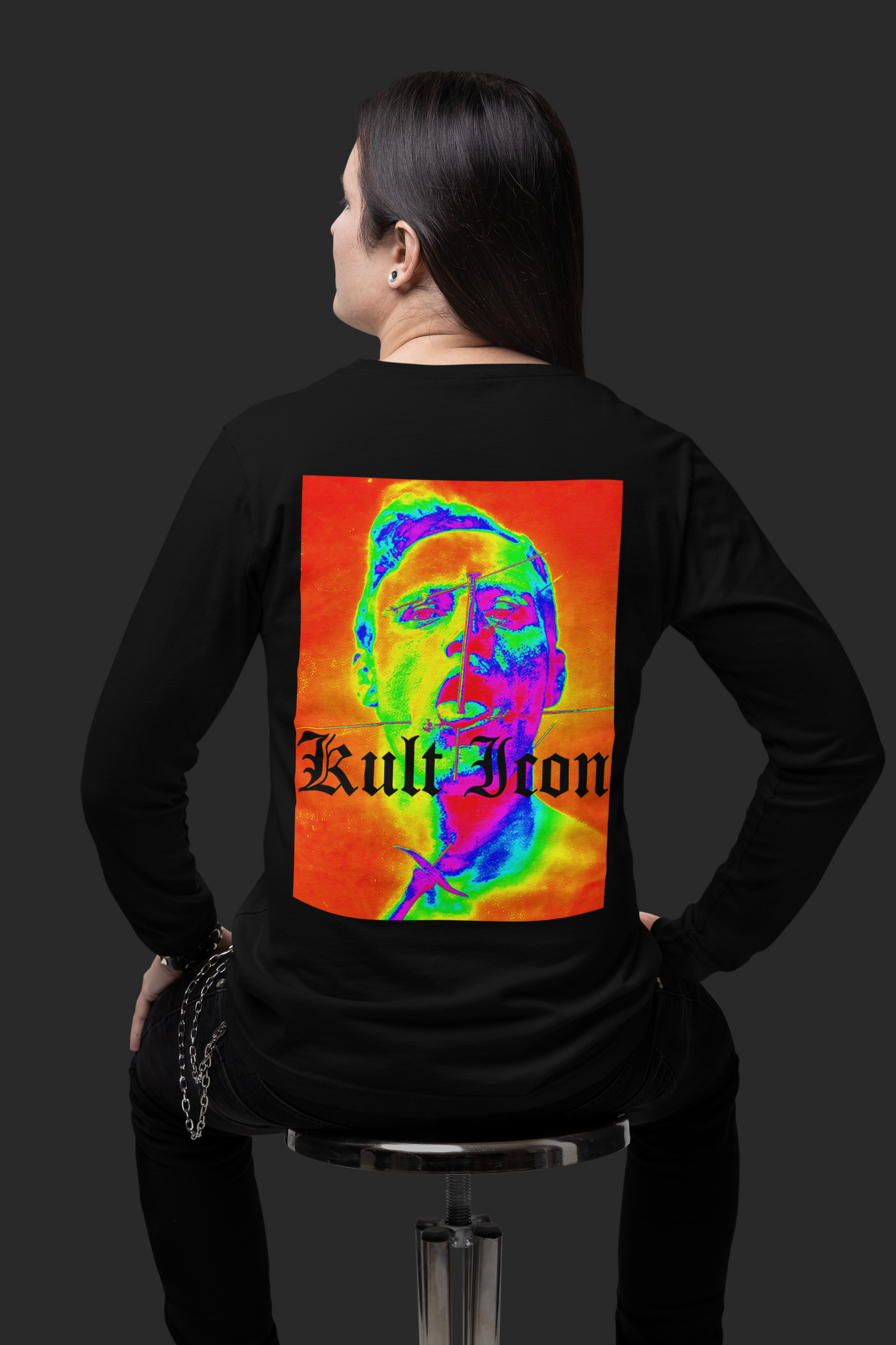 Person wearing a black long-sleeve shirt with a colorful graphic and 'Kult Iron' text on the back.