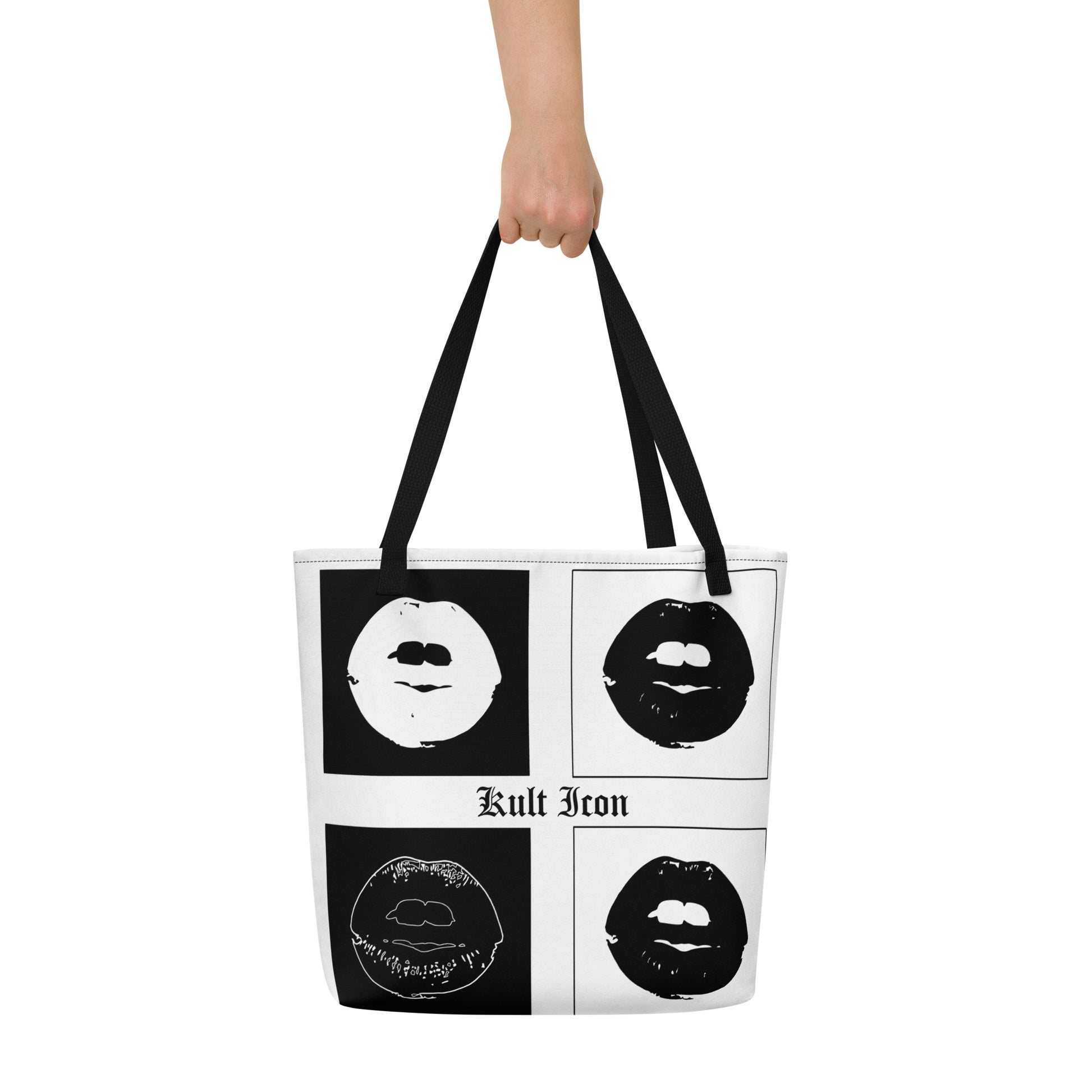 Tote bag with black and white designs and 'Kult Icon' text held by a person on a white background
