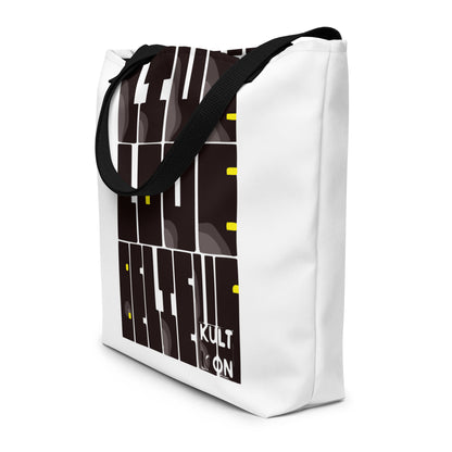 White tote bag with black and yellow geometric pattern on a white background