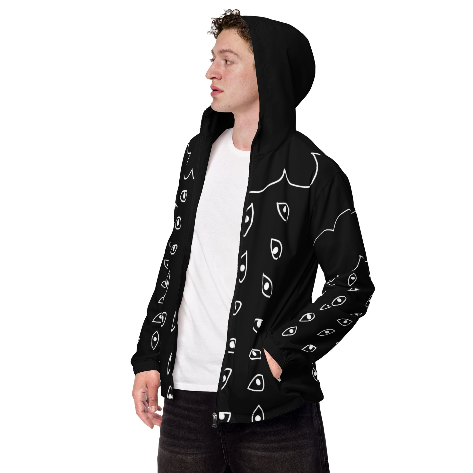 Person wearing a black hoodie with white face patterns on a white background