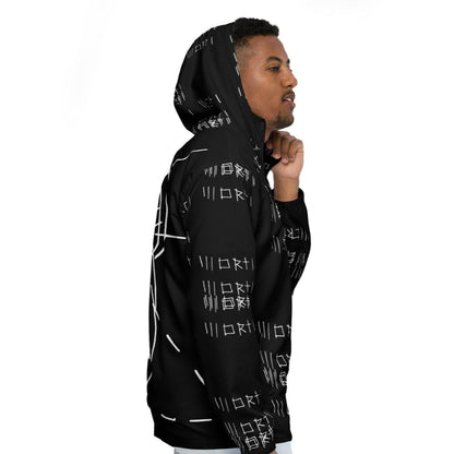 Person wearing a black hoodie with white patterns on a white background