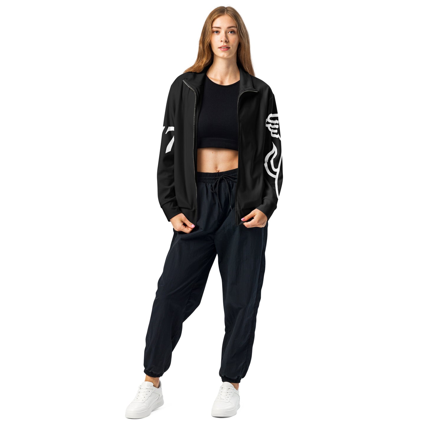 Woman wearing a black tracksuit with white designs on a white background