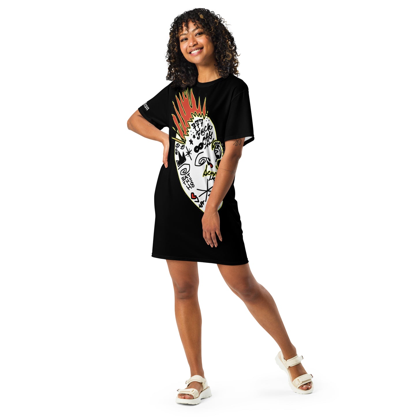 Person wearing a black t-shirt dress with a colorful design on a white background
