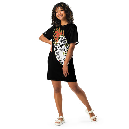 Person wearing a black t-shirt dress with a colorful design on a white background