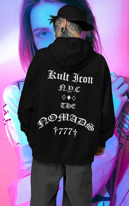 Person wearing a black hoodie with text, standing against a colorful, abstract background.