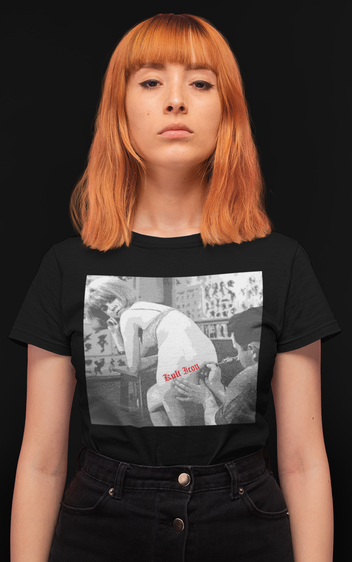 Person wearing a black t-shirt with a graphic design on a black background