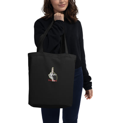 Person holding a black tote bag with a graphic design on a white background