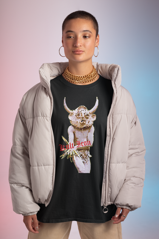 Person wearing a black t-shirt with a graphic design and a beige puffer jacket on a gradient background
