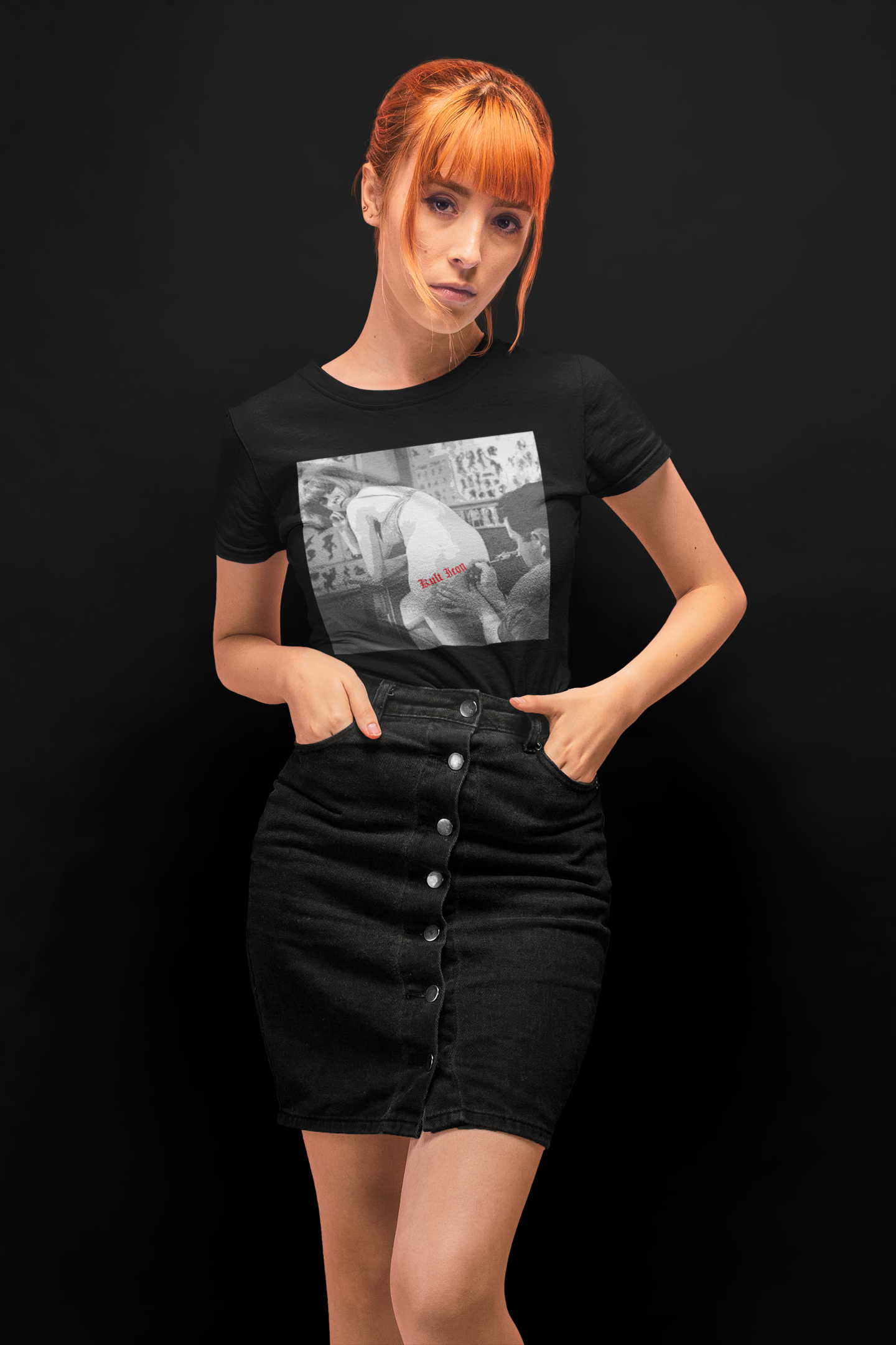 Woman wearing a black t-shirt with a graphic design on a black background