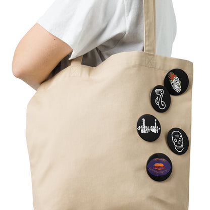 Beige tote bag with decorative buttons on a white background