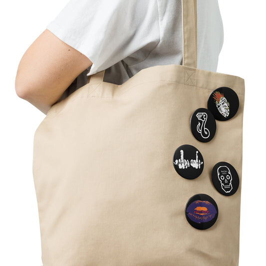 Beige tote bag with decorative buttons on a white background