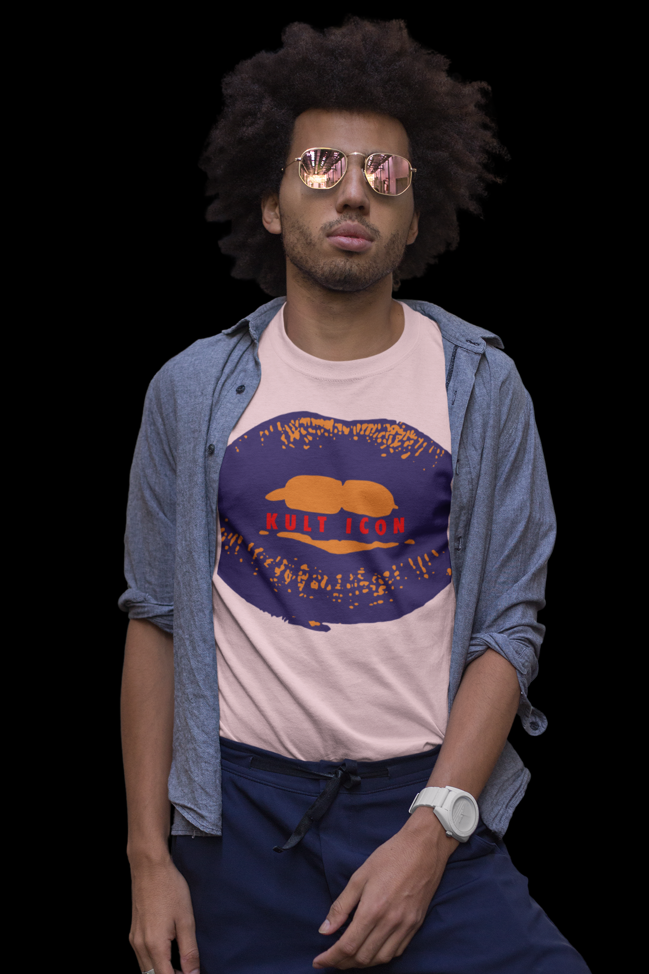Man wearing a graphic t-shirt with a blue jacket on a black background