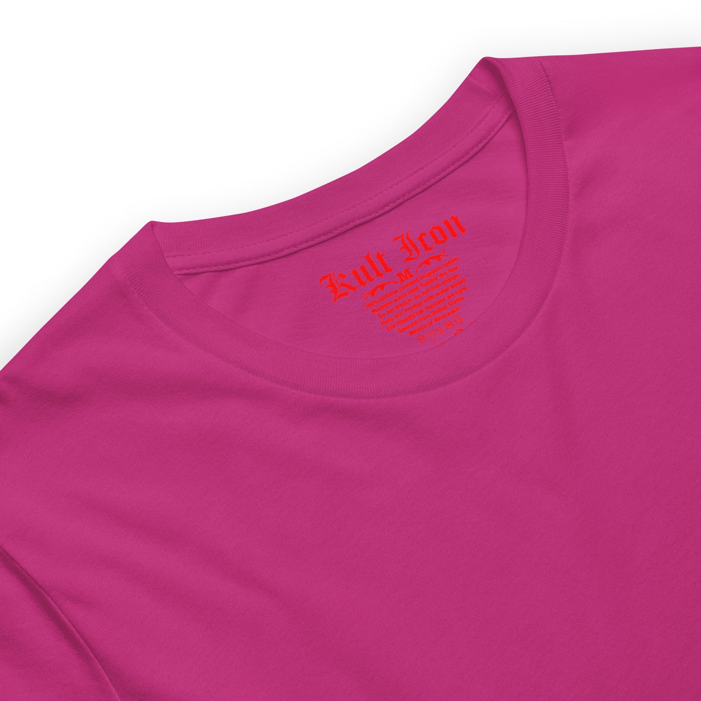 Close-up of a pink shirt with a red logo on a white background