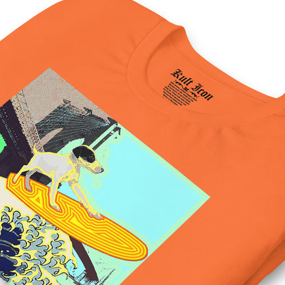 Orange t-shirt with a graphic design of a dog on a surfboard and text on a white background